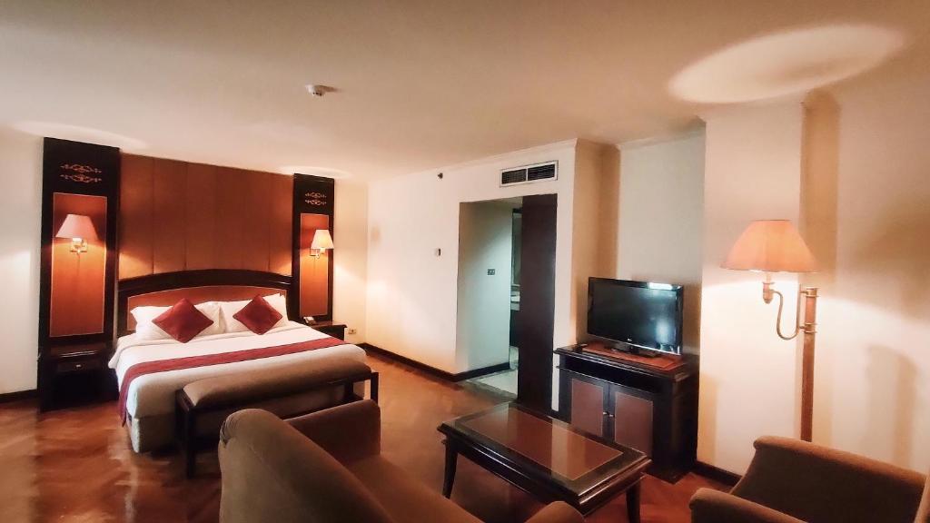 Postel nebo postele na pokoji v ubytování Hotel Kaisar