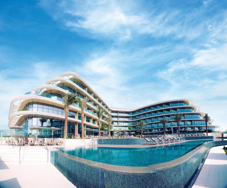 a rendering of a building with a swimming pool at JA The Resort - JA Lake View Hotel in Dubai