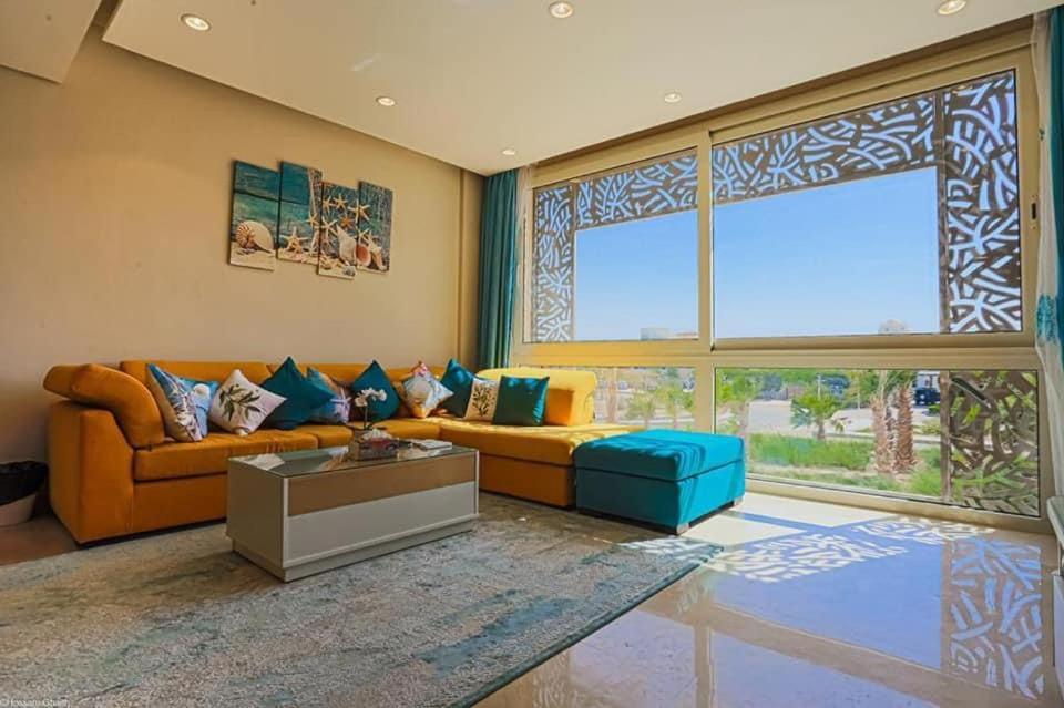 a living room with a couch and a table at Mangarovy El Gouna in Hurghada