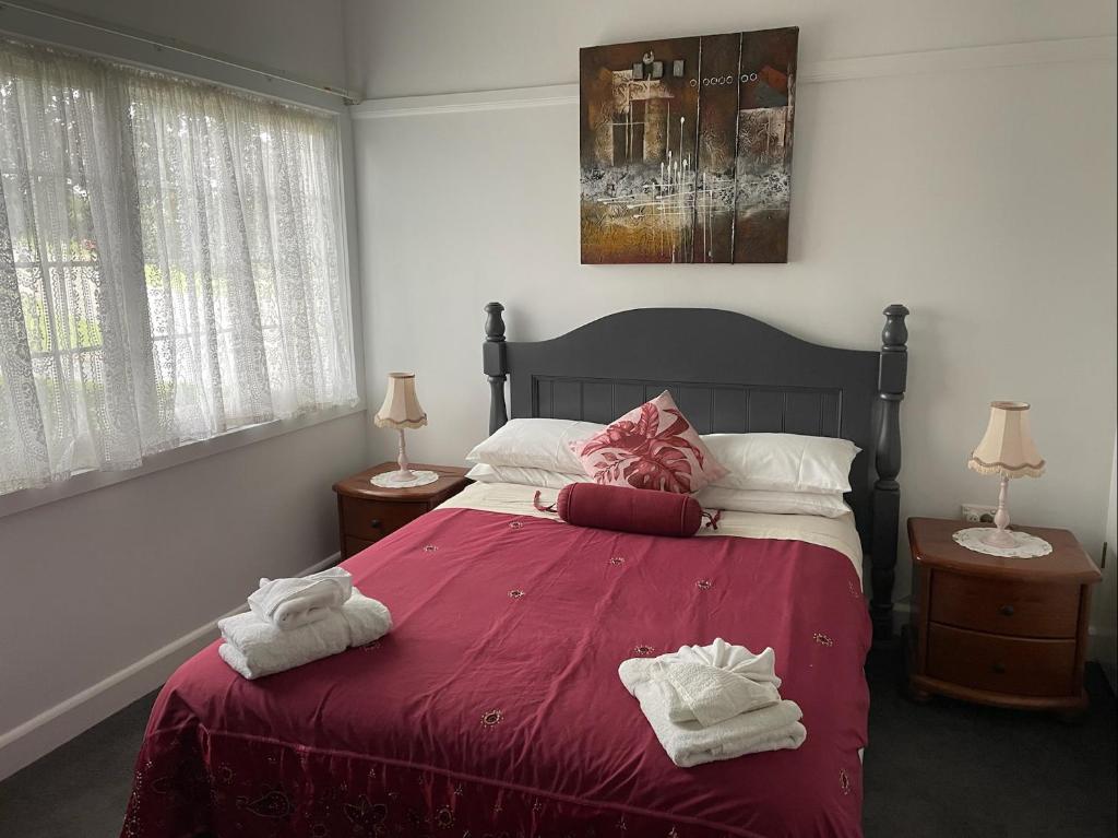 a bedroom with a bed with towels on it at Resonance in Lucknow