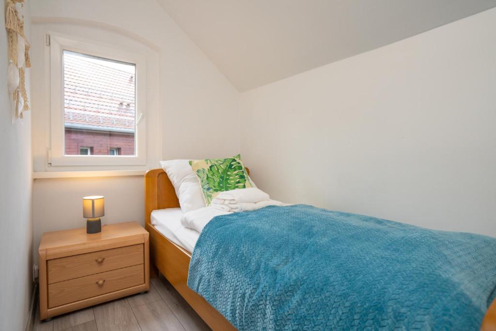 Posteľ alebo postele v izbe v ubytovaní Apartament Regina