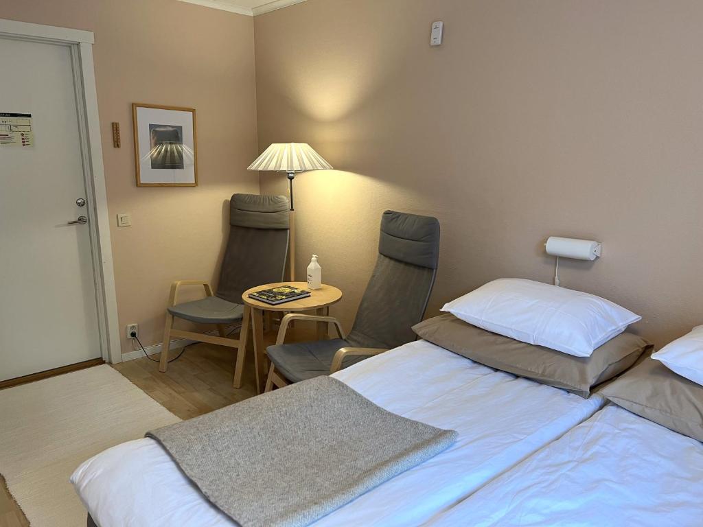 Postel nebo postele na pokoji v ubytování Fulufjällsgården