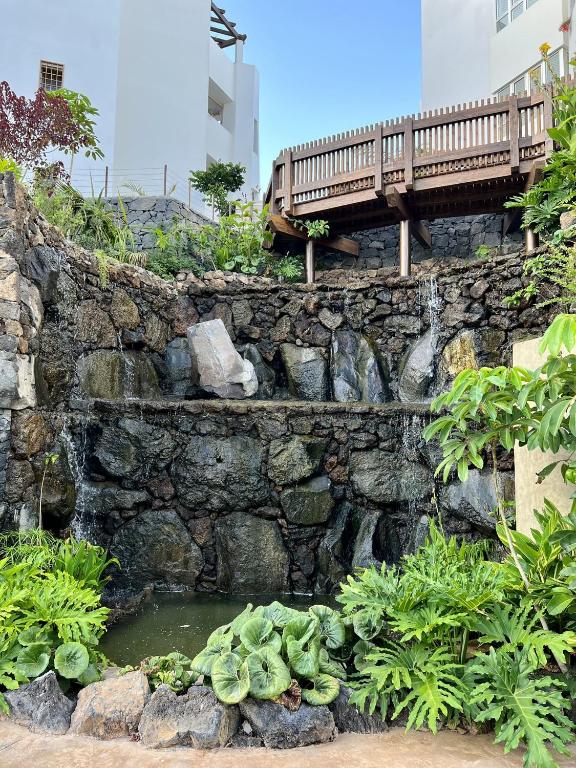 A garden outside Jardines - Tisaya 11 POOL VIEW & TWIN BEDS 1B