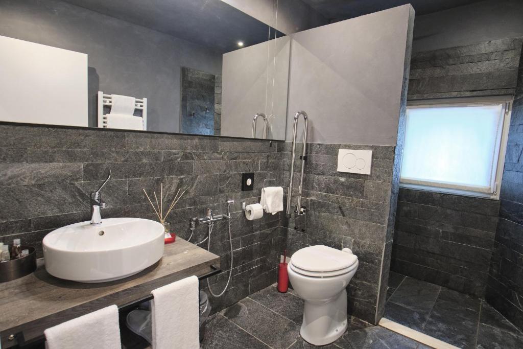 Koupelna v ubytování Capriccio Art Hotel