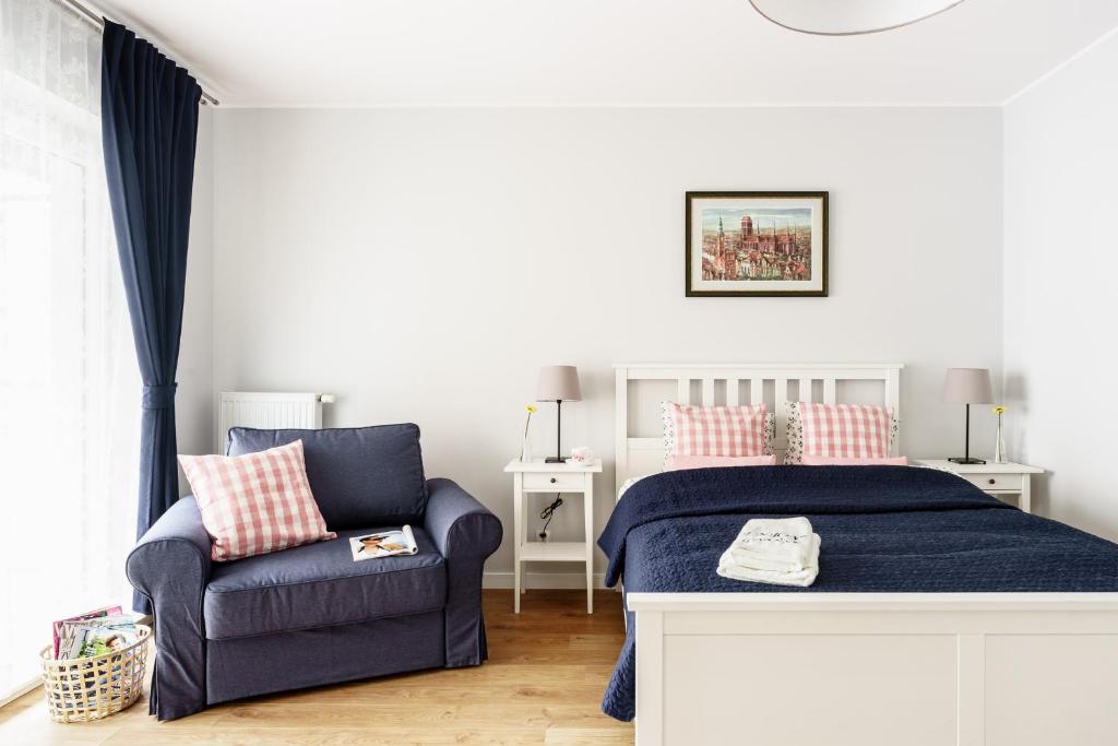 Posteľ alebo postele v izbe v ubytovaní Flatbook - City Center SPA Apartments Motlawa