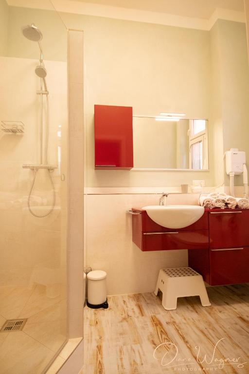 Koupelna v ubytování Historia Hotel