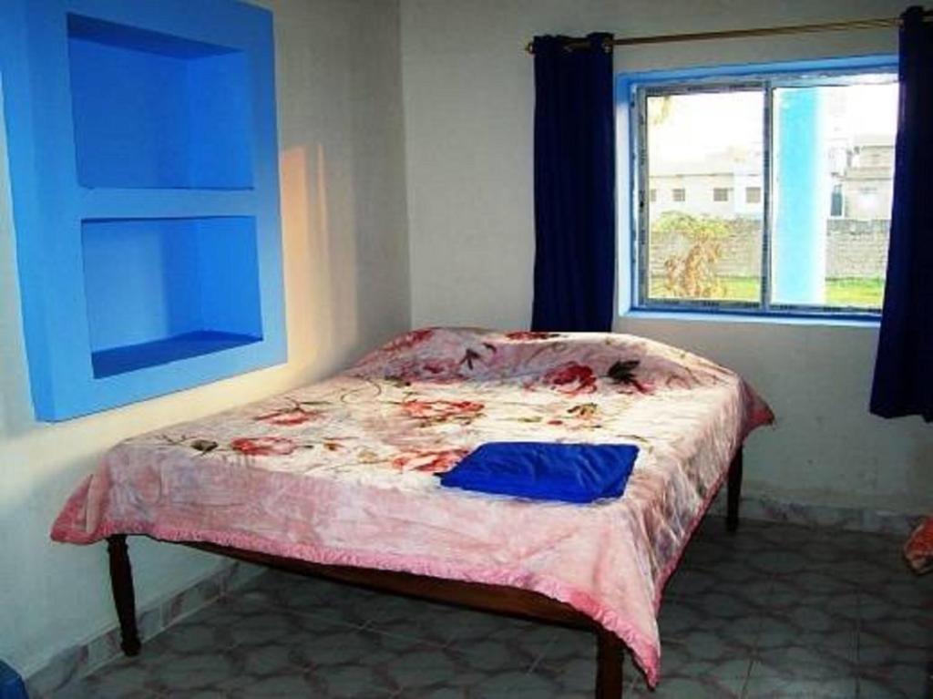 Letto o letti in una camera di Tara Guest House