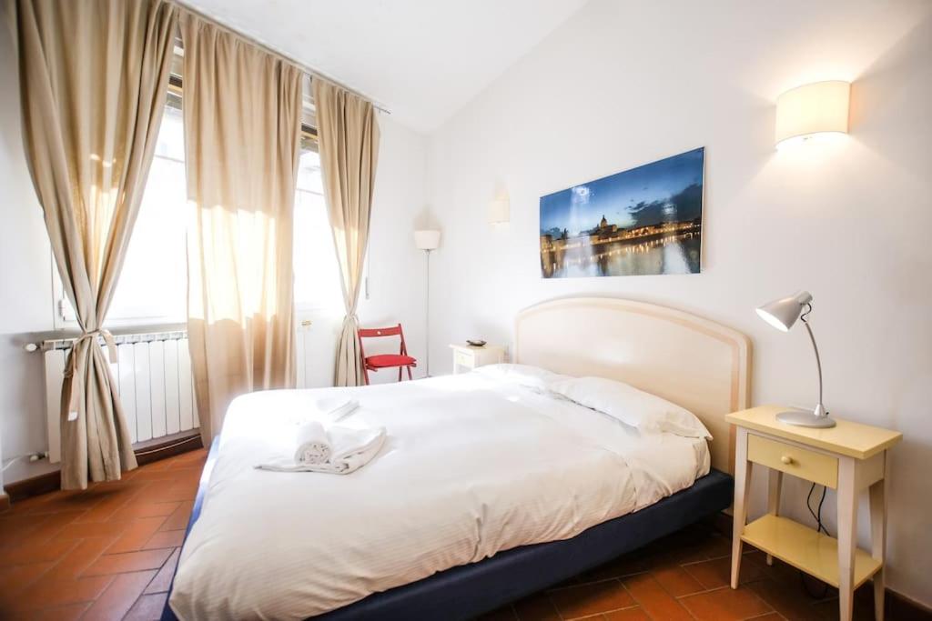 Posteľ alebo postele v izbe v ubytovaní Nice Apartment Near Ponte Vecchio