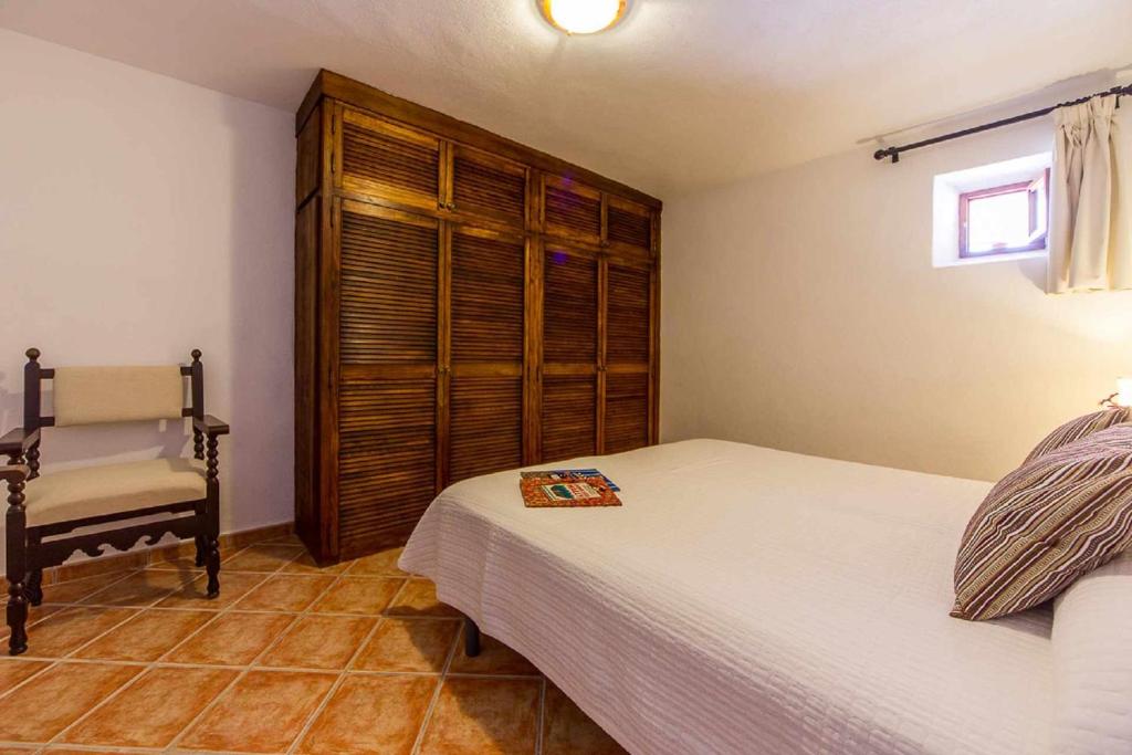A bed or beds in a room at Finca Cas Contador Mallorca