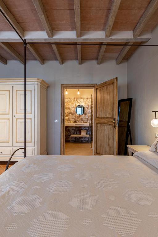 Postel nebo postele na pokoji v ubytování Casa Mustiola