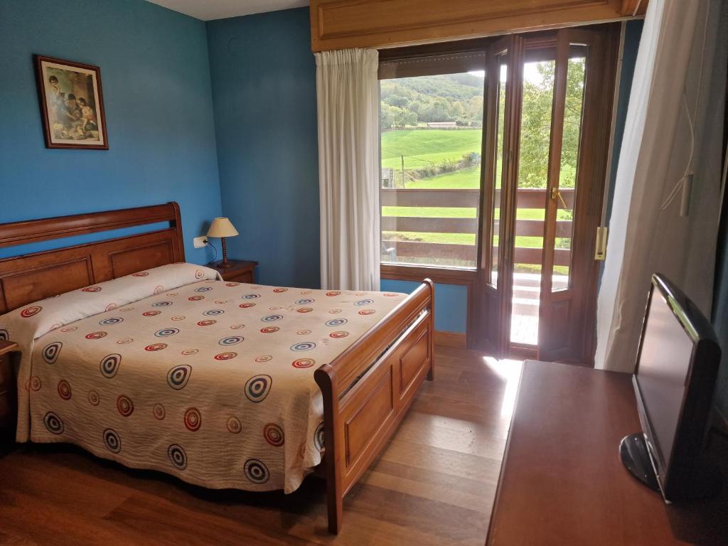 Postel nebo postele na pokoji v ubytování Hostal Lizuniaga