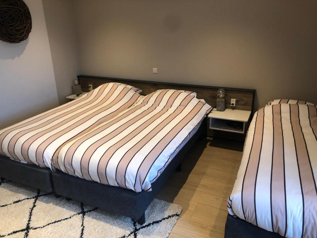 Postel nebo postele na pokoji v ubytování Hotel Zuideinde