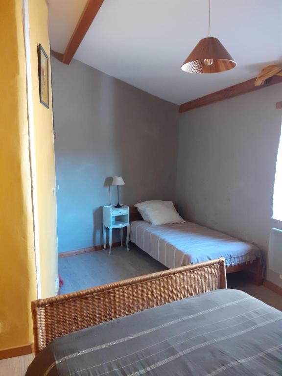 Postel nebo postele na pokoji v ubytování Gite de Pascal et Virginie