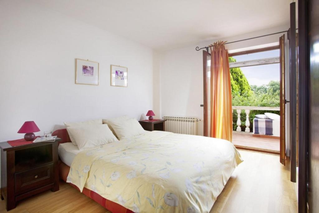 Postel nebo postele na pokoji v ubytování Villa Aurata in Ližnjan (Haus für 8-9 Personen)