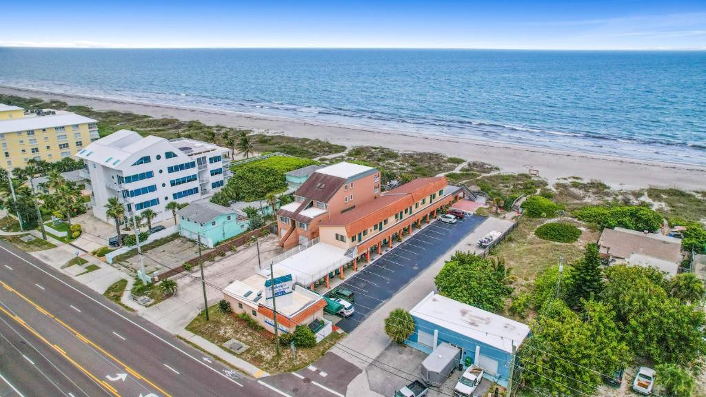 an aerial view of a beach with buildings and the ocean at Anthony's on the Beach in Cocoa Beach