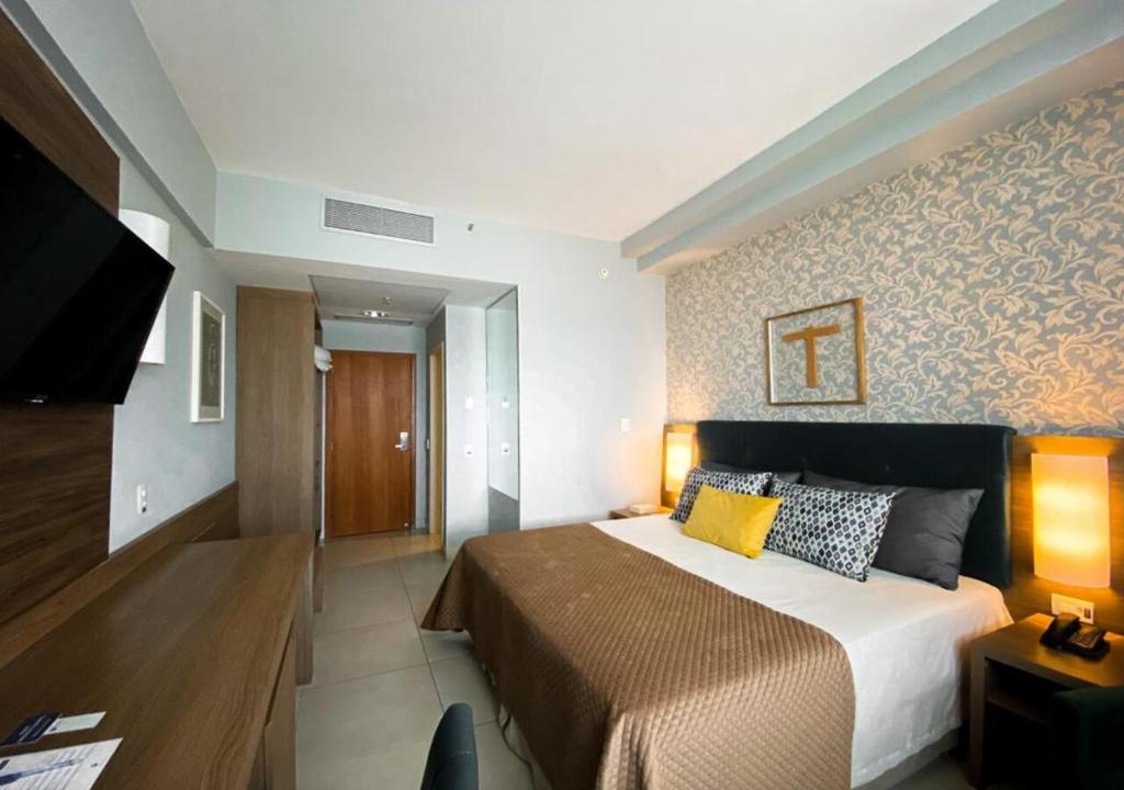 Postel nebo postele na pokoji v ubytování Hotel Rainha do Brasil