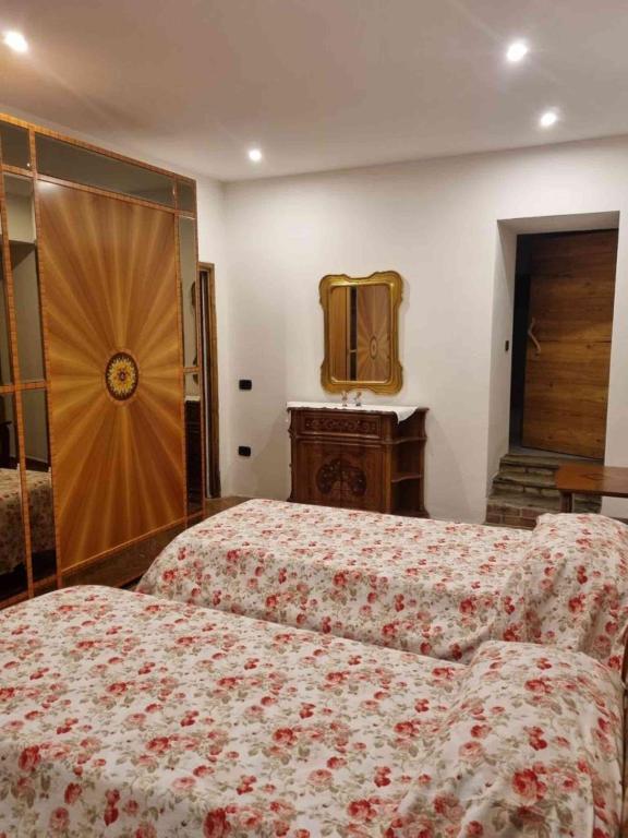 Postel nebo postele na pokoji v ubytování B&B la Curt del Böff