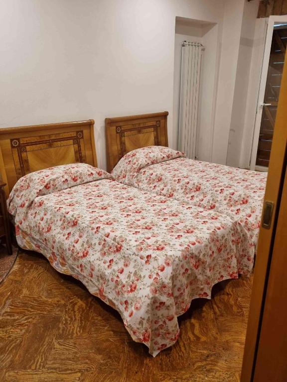 Postel nebo postele na pokoji v ubytování B&B la Curt del Böff