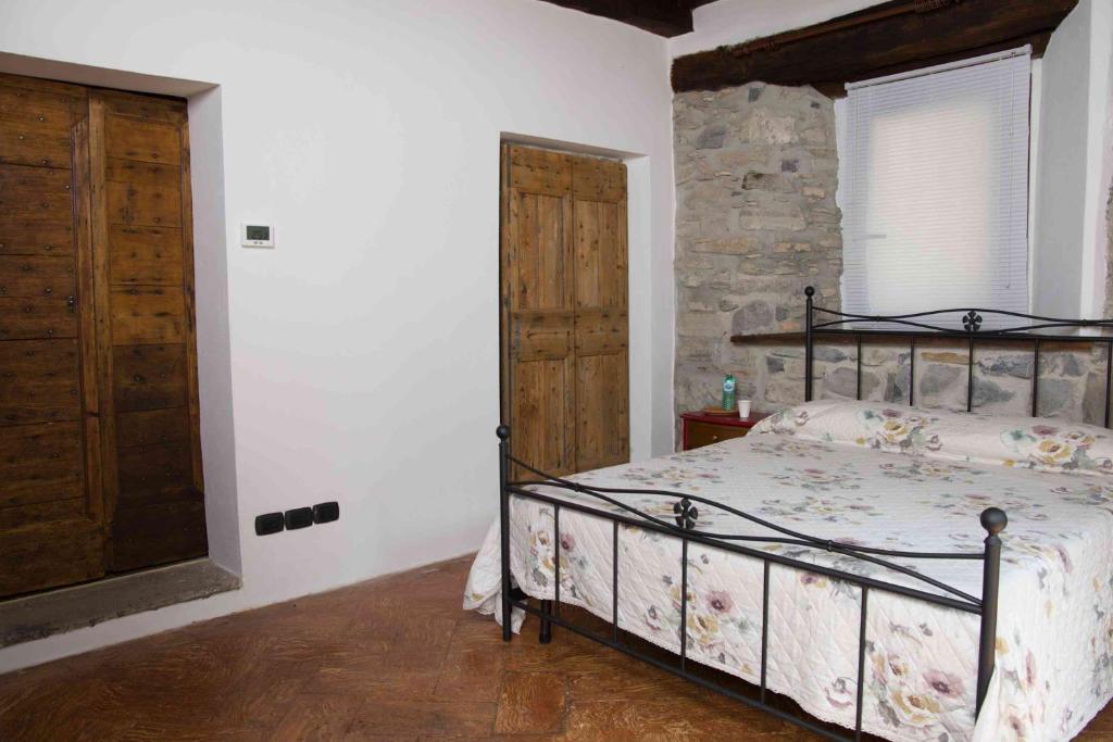 Postel nebo postele na pokoji v ubytování B&B la Curt del Böff