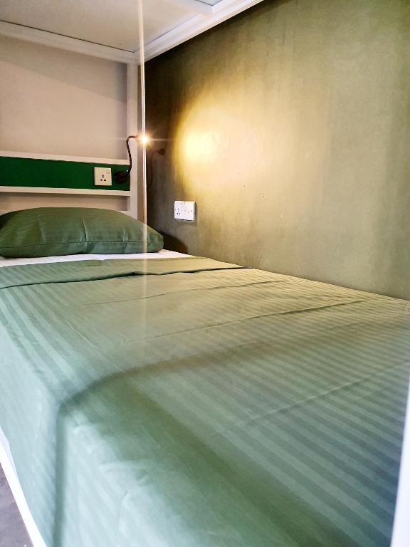 Postel nebo postele na pokoji v ubytování Downtown Hostels Ella
