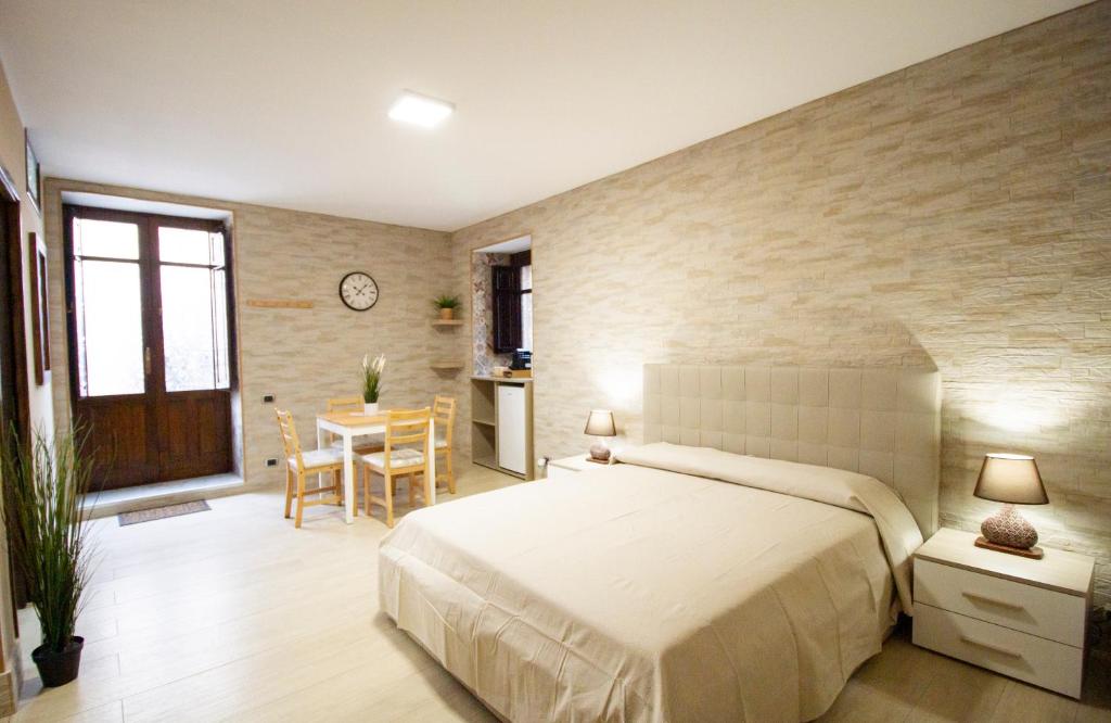 Postel nebo postele na pokoji v ubytování Iris Ortigia Apartments