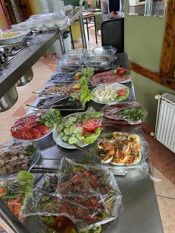 a buffet line with many different plates of food at Ayça Konaklama in Sakarya