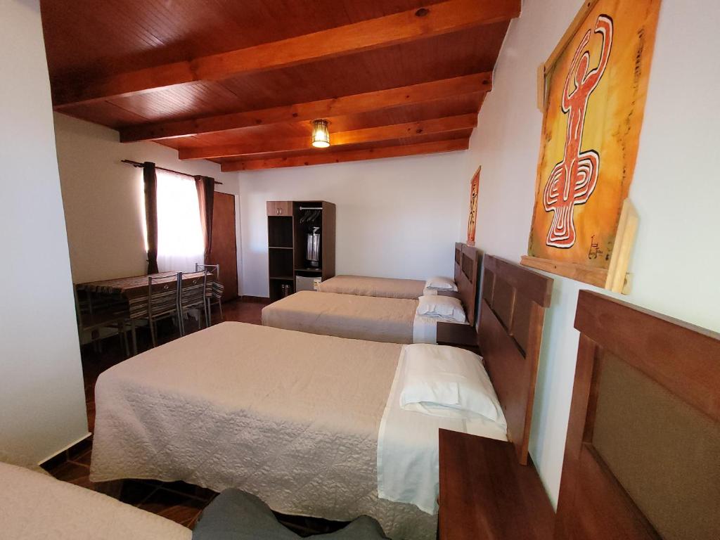 Uma cama ou camas num quarto em Lalck Cketi Hospedaje y Turismo