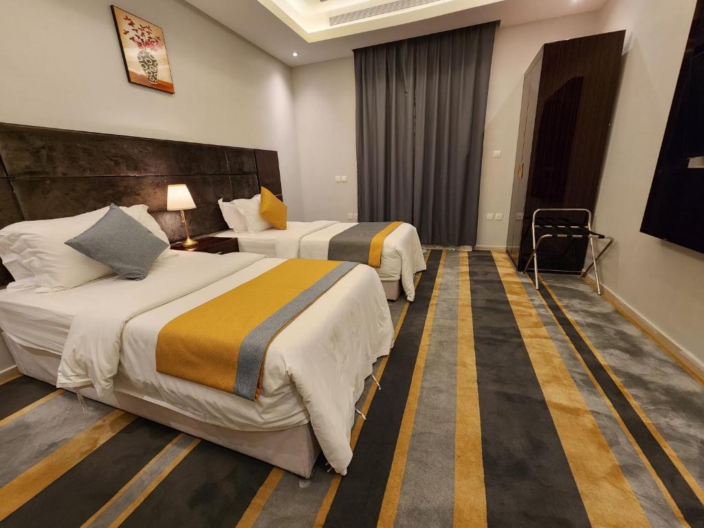 Postel nebo postele na pokoji v ubytování Rasis Furnished Apartments