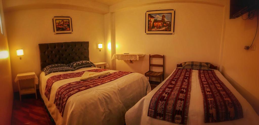 Postel nebo postele na pokoji v ubytování Hotel Willcamayu