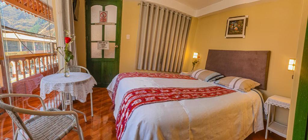 Postel nebo postele na pokoji v ubytování Hotel Willcamayu