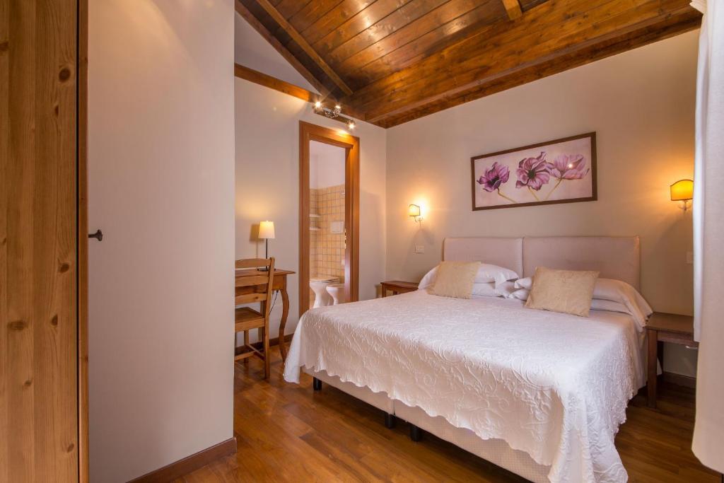 Postel nebo postele na pokoji v ubytování Antica Locanda Palmieri