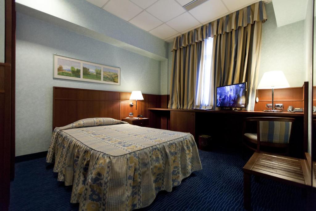 Postel nebo postele na pokoji v ubytování Palace Hotel Moderno