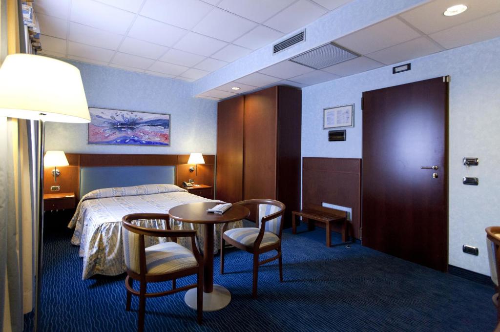 Postel nebo postele na pokoji v ubytování Palace Hotel Moderno