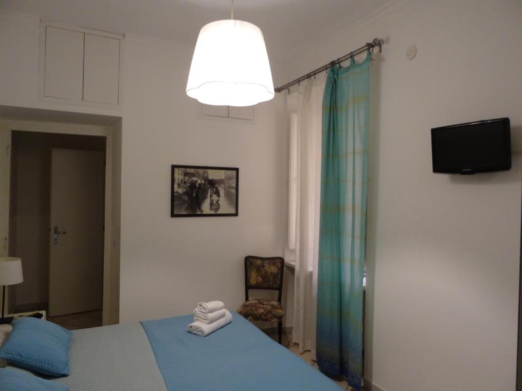 A bed or beds in a room at Linnéa Roma Centro A
