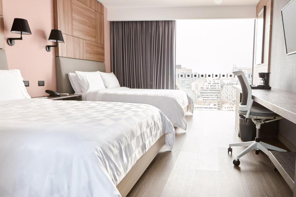 Voodi või voodid majutusasutuse Holiday Inn - Lima Miraflores by IHG toas