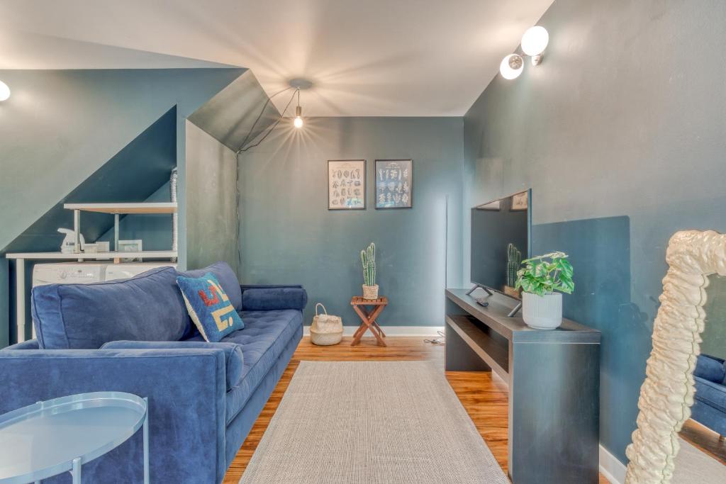 a living room with a blue couch and a table at Portland Blues in Portland