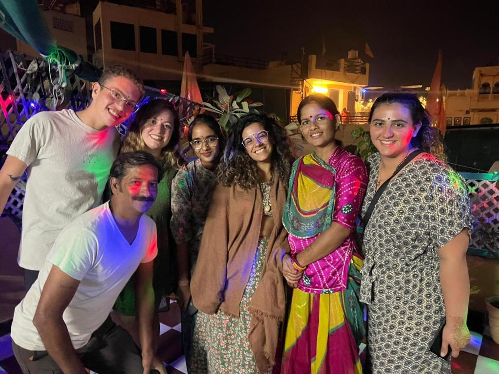 a group of people posing for a picture at a party at Black Pepper Home Stay in Udaipur