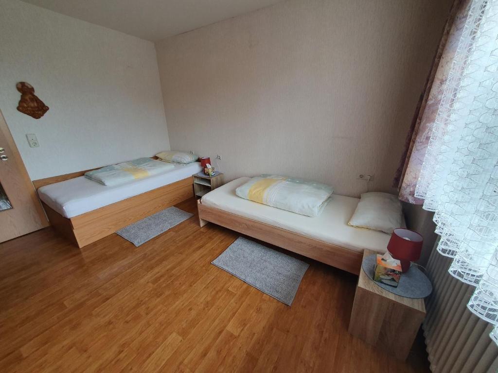 Postel nebo postele na pokoji v ubytování Apartment in Görwihl near Black Forest Waterfalls