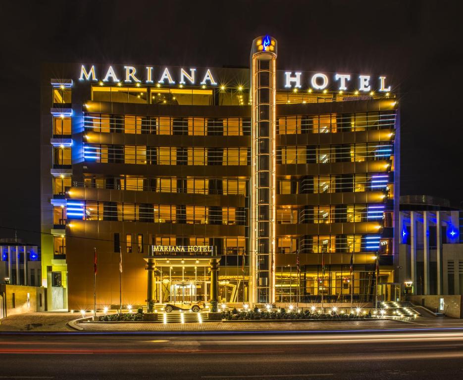 a night view of a mariana hotel at night at Mariana Hotel Erbil in Erbil