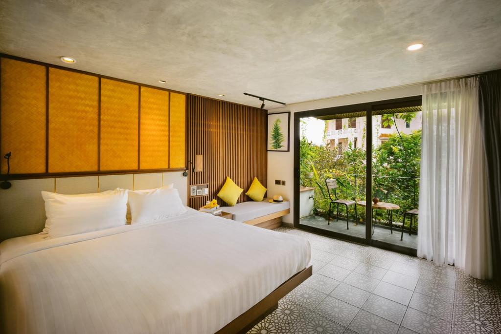 Llit o llits en una habitació de LIVIE Da Nang Style