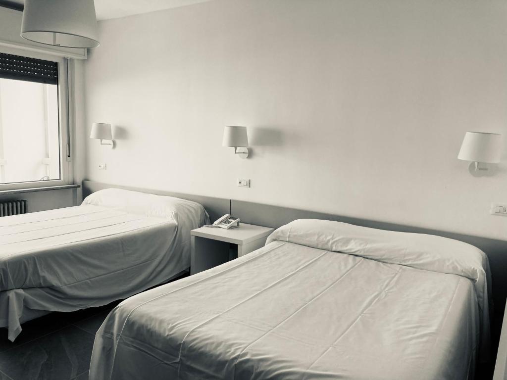Letto o letti in una camera di Hotel Ghironi
