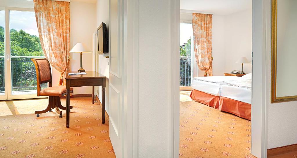 Postel nebo postele na pokoji v ubytování Victor's Residenz-Hotel Berlin Mitte