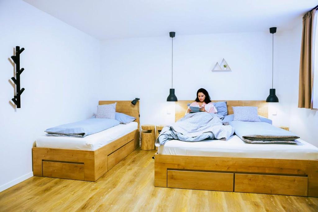 Postel nebo postele na pokoji v ubytování Bylo Nebylo apartmány
