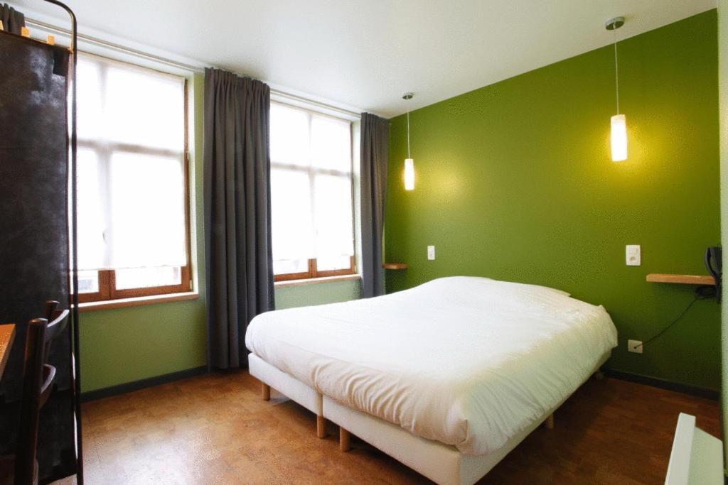 Postel nebo postele na pokoji v ubytování Hotel O Mal Aime