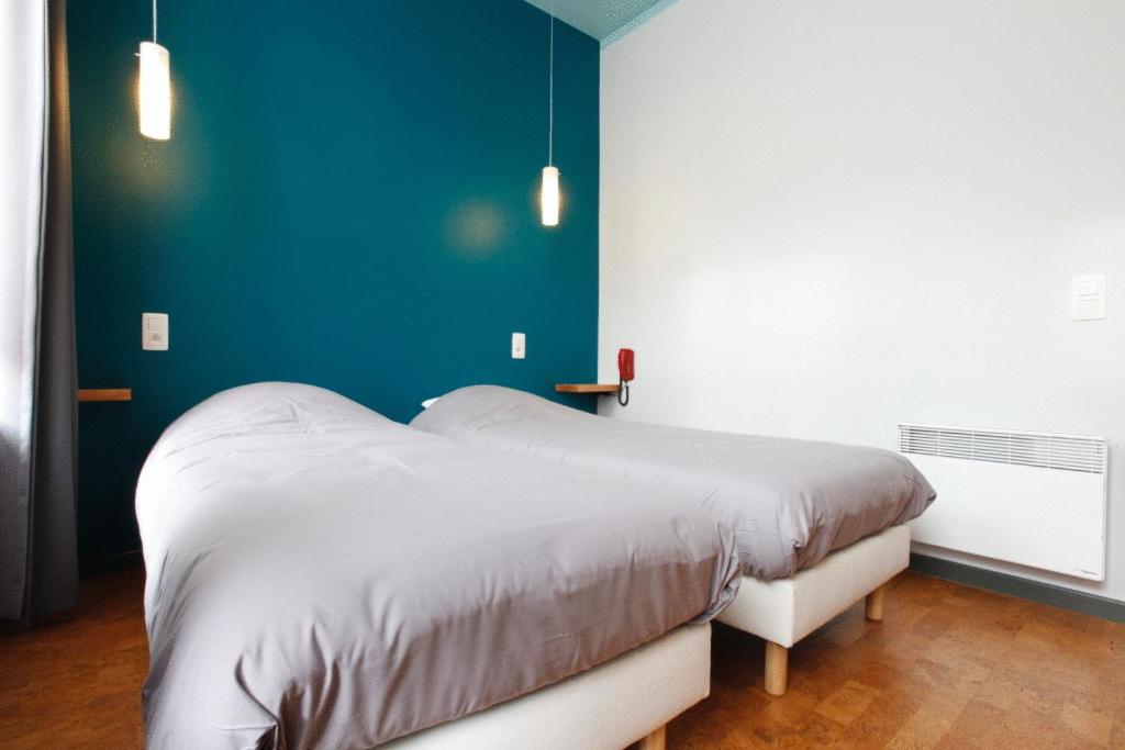 Postel nebo postele na pokoji v ubytování Hotel O Mal Aime