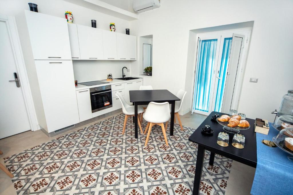 Kuchyň nebo kuchyňský kout v ubytování B&B Riccioli
