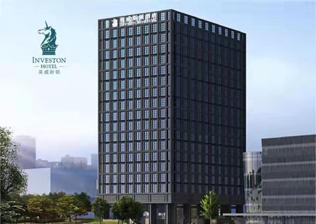 a tall building with many windows in a city at 深圳英威斯顿酒店 Investon Hotel Shenzhen in Lung Wa