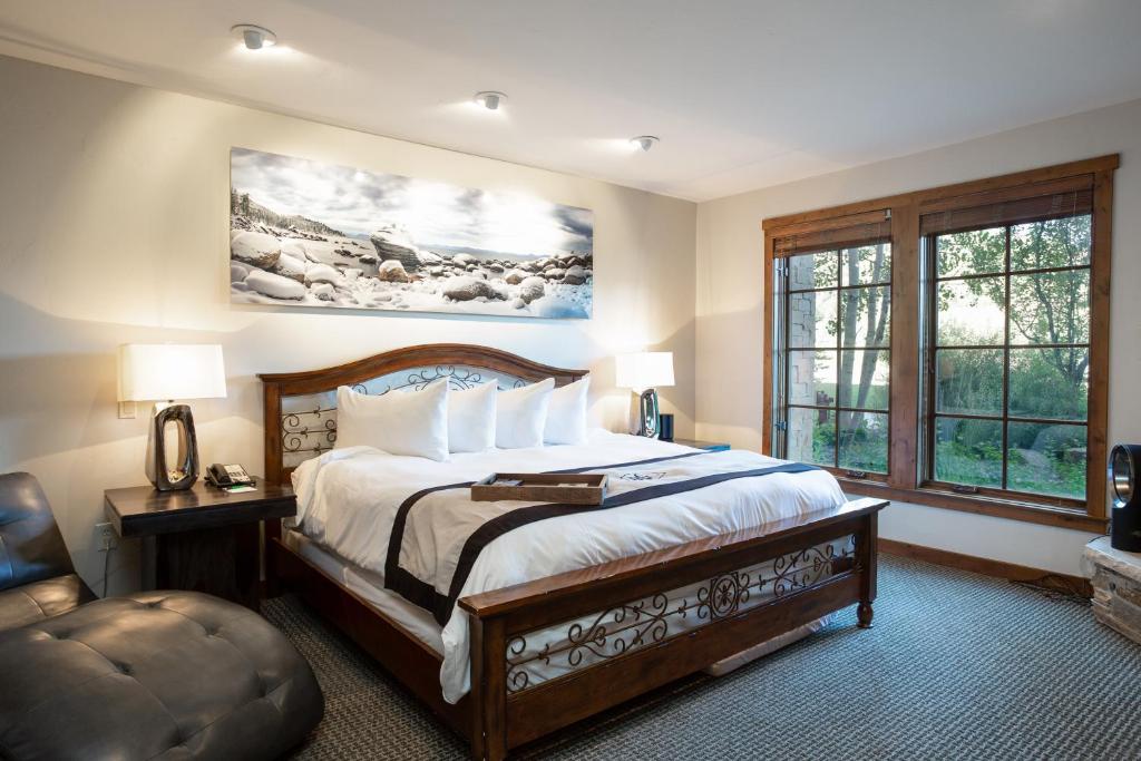 a bedroom with a bed and a large window at 1 Bedroom Condo with Spa - Silver Baron Lodge condo in Park City