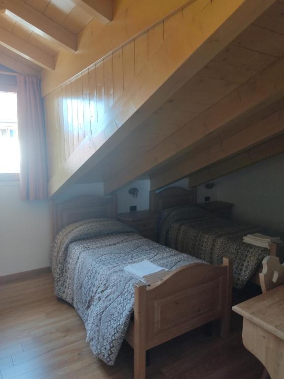 Postel nebo postele na pokoji v ubytování Appartamenti Meoti
