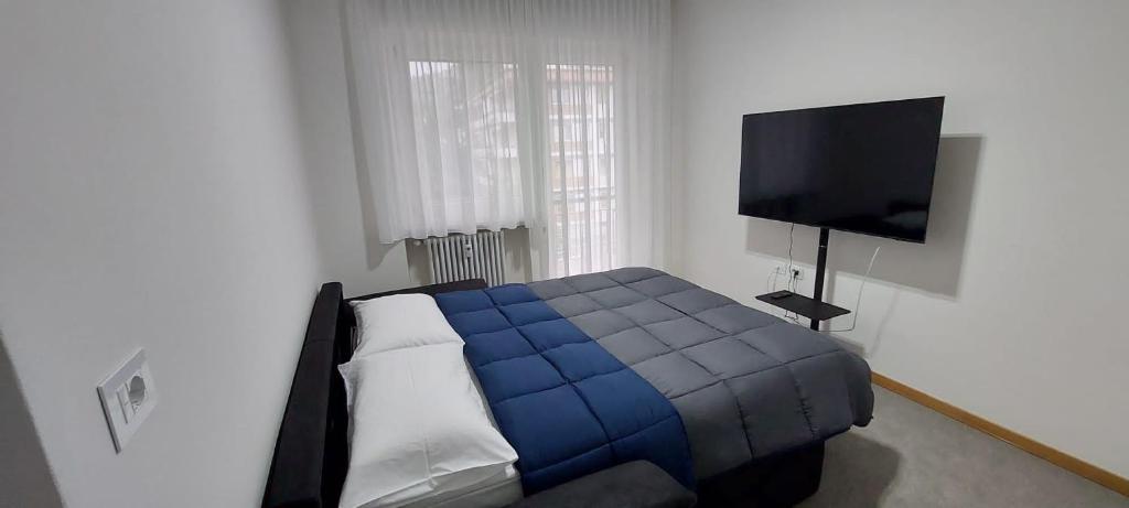 A bed or beds in a room at Appartamento Laura